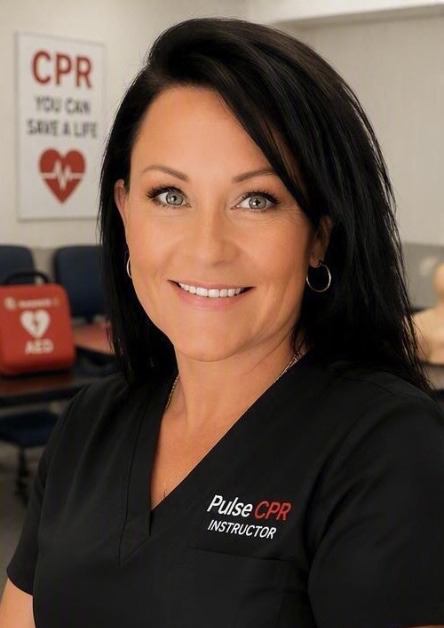 Christine Oldenburg, RN, Pulse CPR instructor wearing the Pulse CPR instructor top